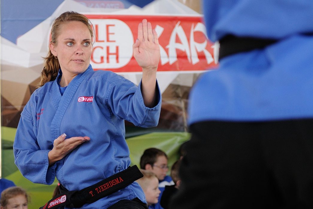 Adult woman training in a Mile High Karate self-defense class