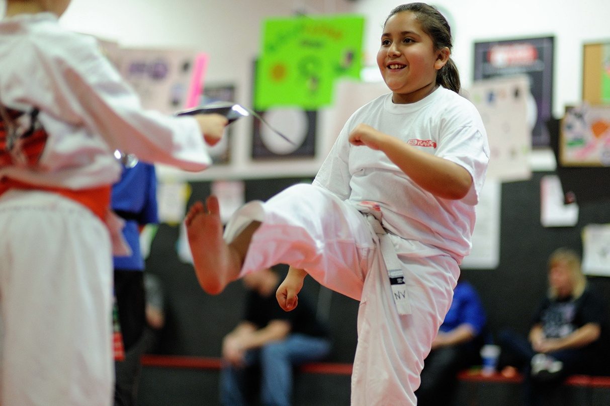 Mile High Karate student practicing a front kick in class