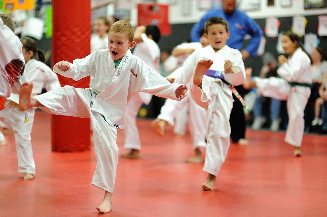 Mile High Karate Thornton students practicing kicks in class
