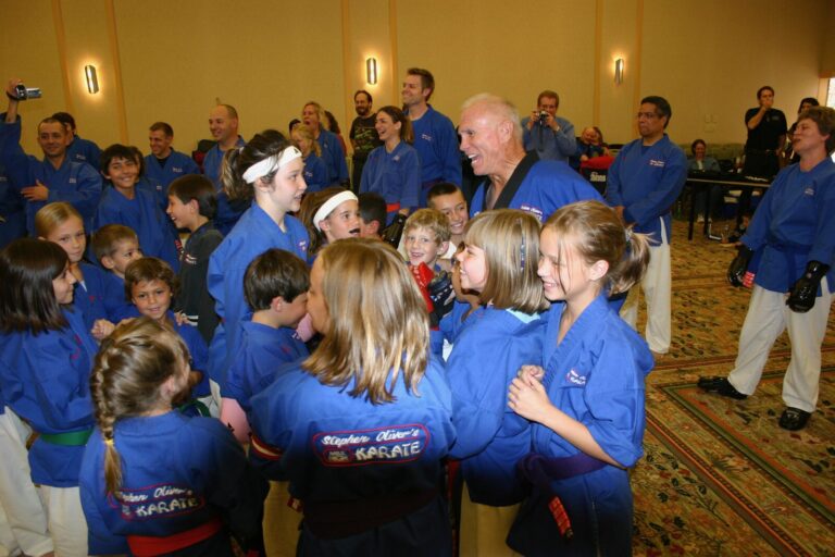 Students in blue Mile High Karate uniforms gathered around instructors at the 2007 Champion's Reunion